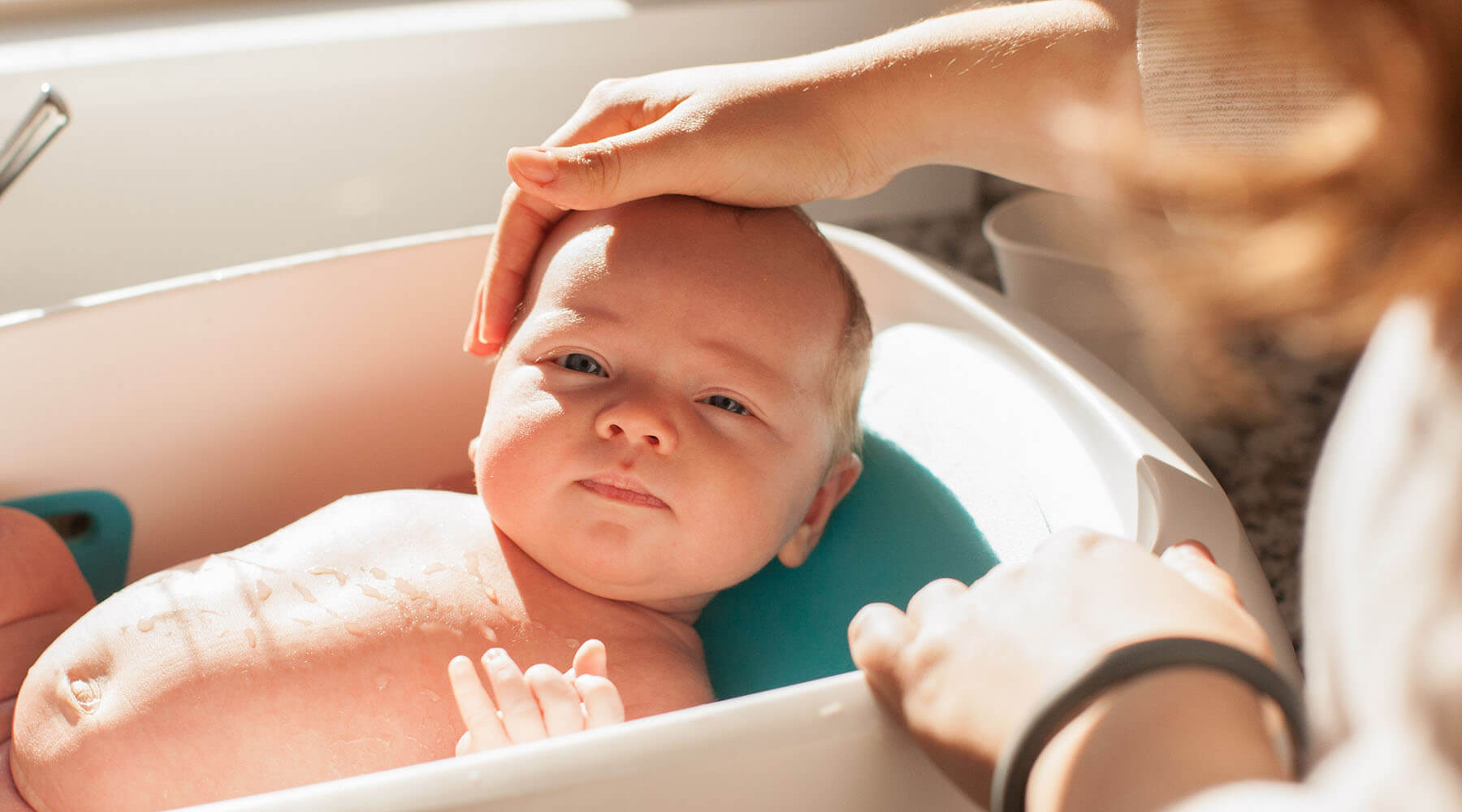 Baby with dry skin in tub