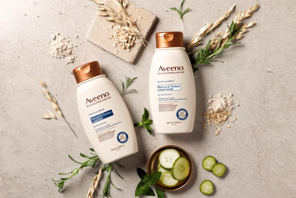 Aveeno® Refresh & Thicken haircare set displayed with its nourishing ingredients that add thickness to hair