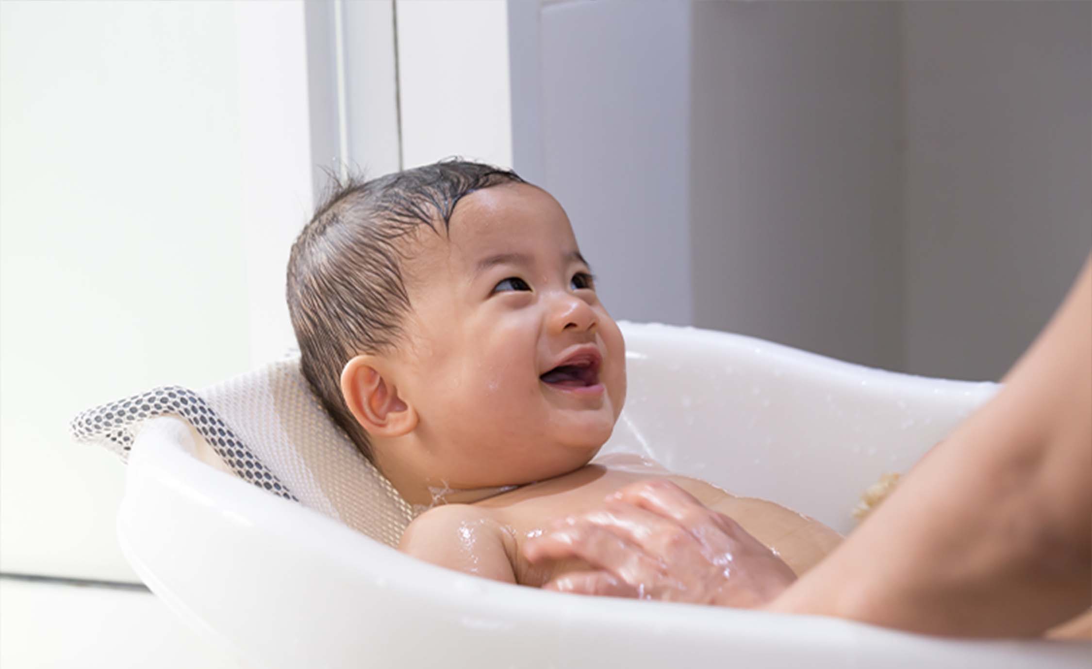 Baby laughing in bath